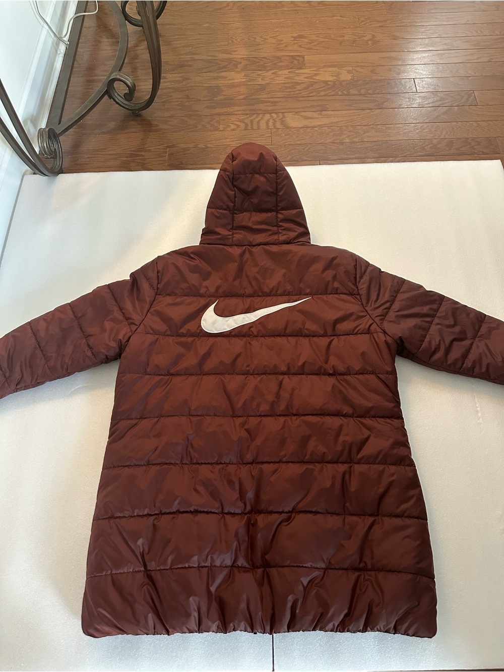 Nike Women's Long Puffer Coat in Rust Brown